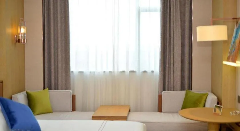 Bed in AUGUSTINE HOTEL