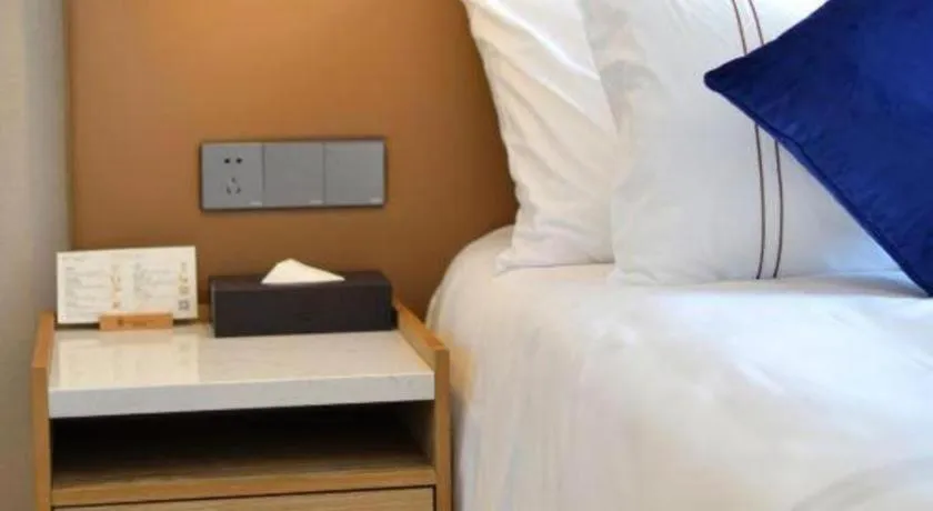 Bed in AUGUSTINE HOTEL