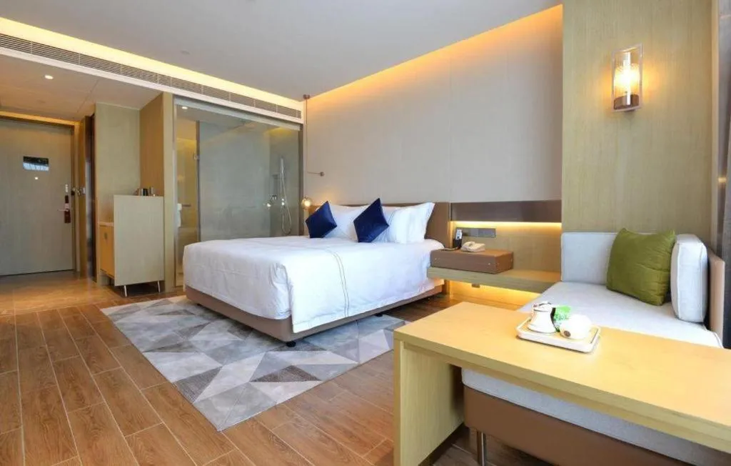 Bed in AUGUSTINE HOTEL