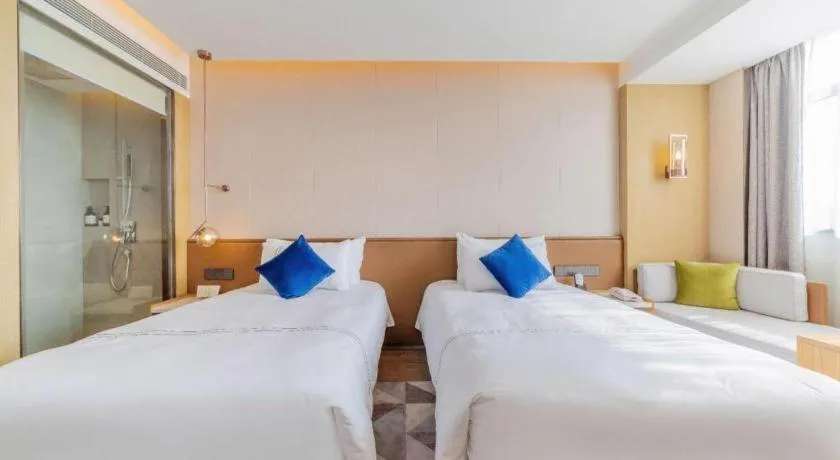 Bed in AUGUSTINE HOTEL