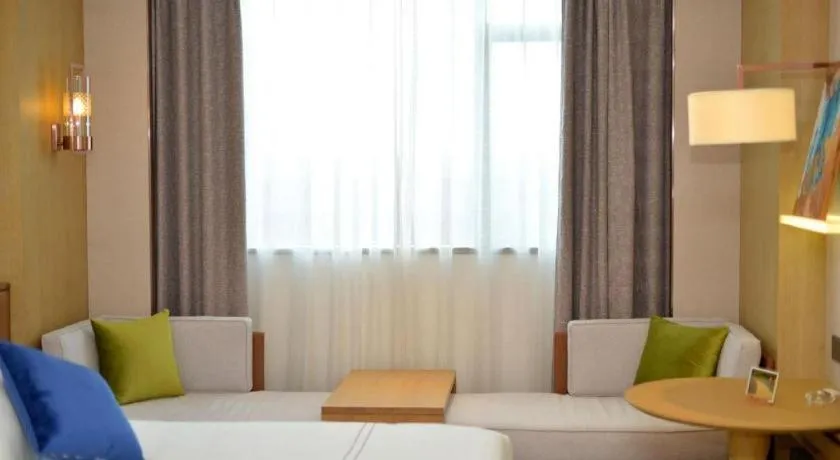 Bed in AUGUSTINE HOTEL