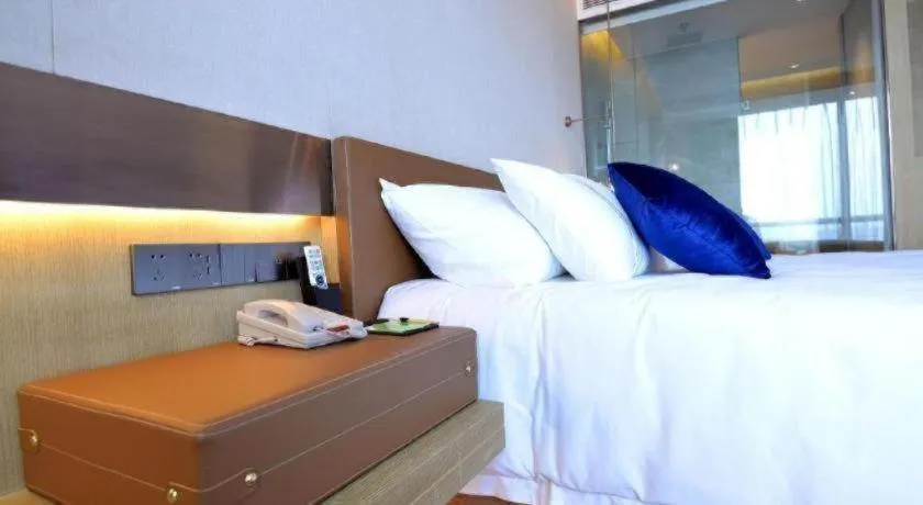 Bed in AUGUSTINE HOTEL