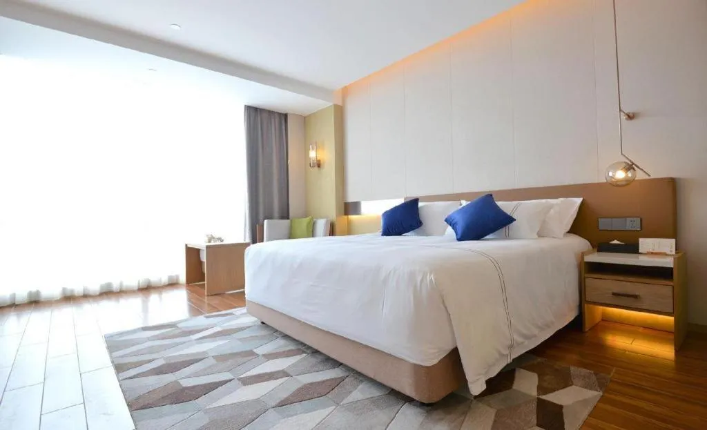 Bed in AUGUSTINE HOTEL