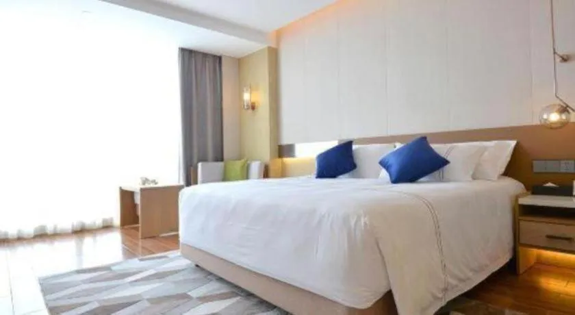 Bed in AUGUSTINE HOTEL