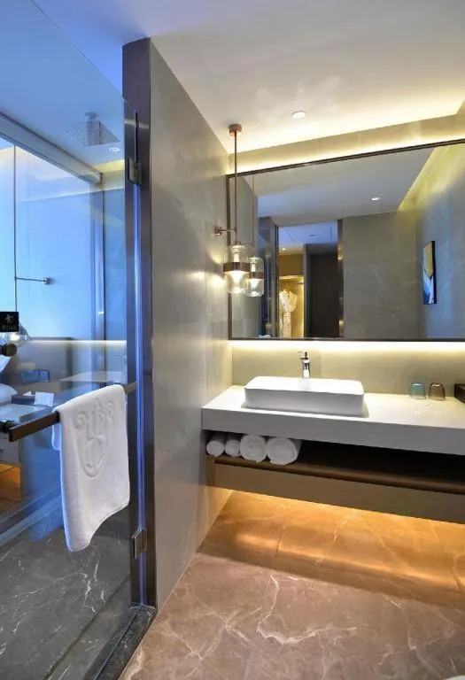 Bed in AUGUSTINE HOTEL