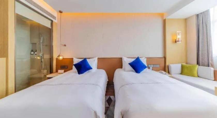 Bed in AUGUSTINE HOTEL