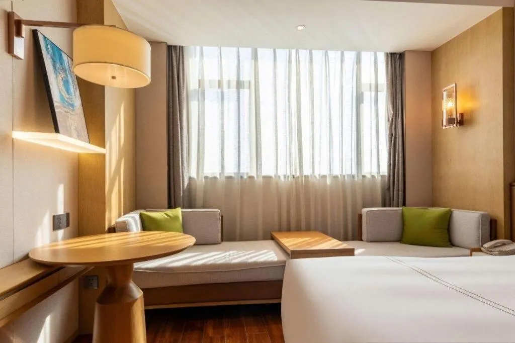 Bed in AUGUSTINE HOTEL