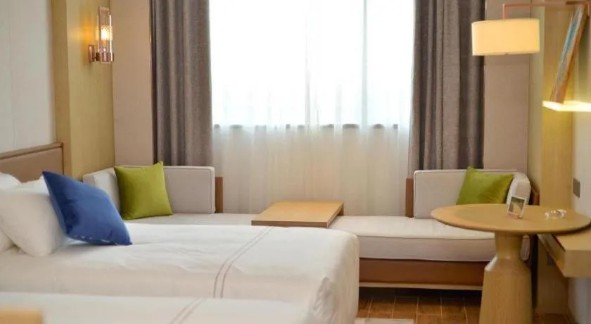 Bed in AUGUSTINE HOTEL