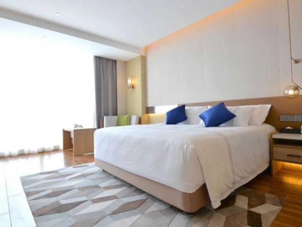 Bed in AUGUSTINE HOTEL