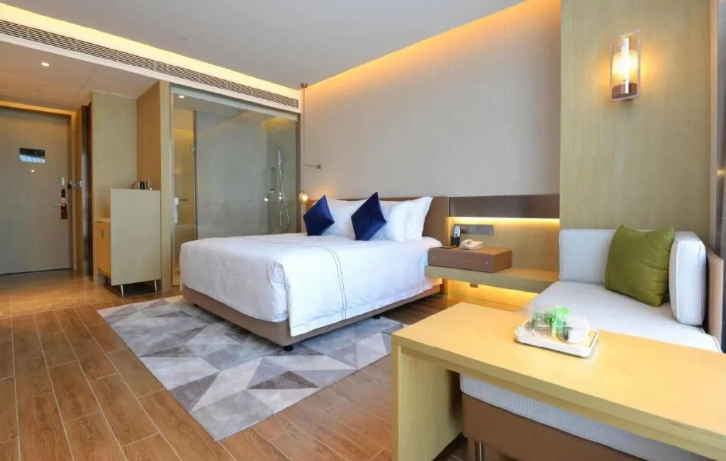 Bed in AUGUSTINE HOTEL