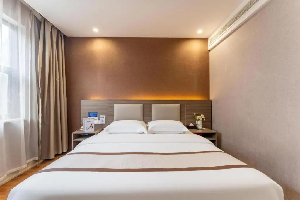 Bed in Jtour Inn Wuxi Meiyuan Kaiyuan Temple Metro