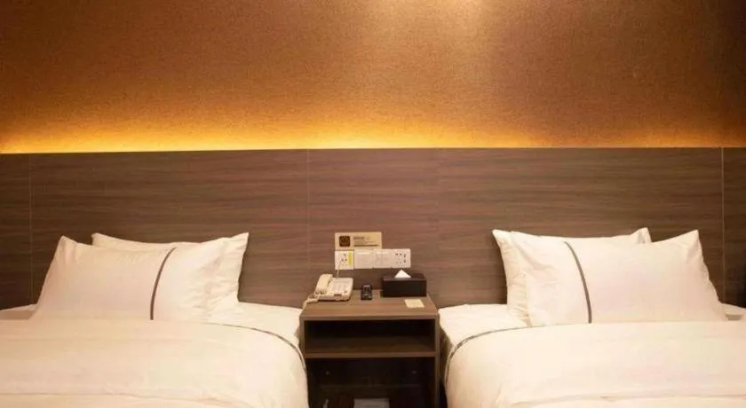 Bed in Jtour Inn Wuxi Meiyuan Kaiyuan Temple Metro