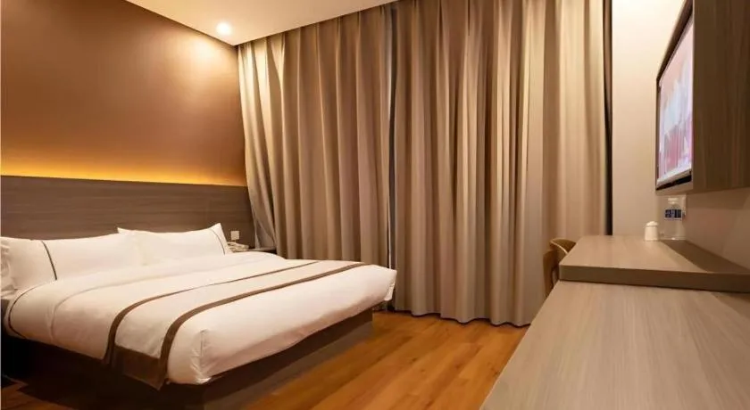 Bed in Jtour Inn Wuxi Meiyuan Kaiyuan Temple Metro