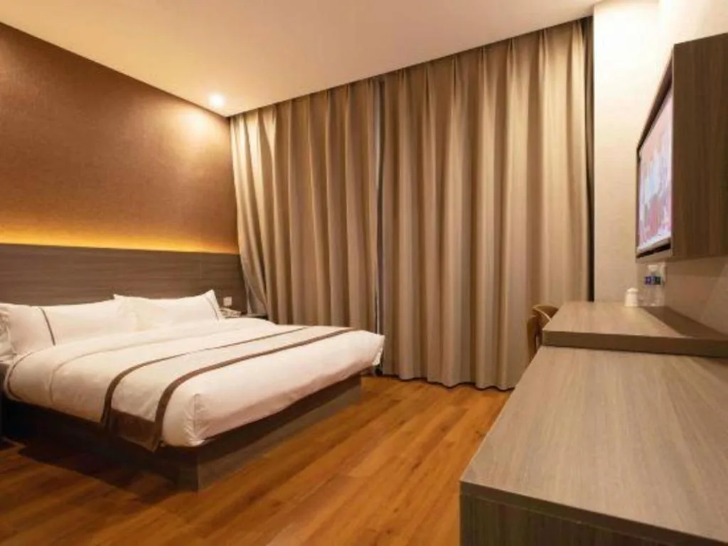 Bed in Jtour Inn Wuxi Meiyuan Kaiyuan Temple Metro