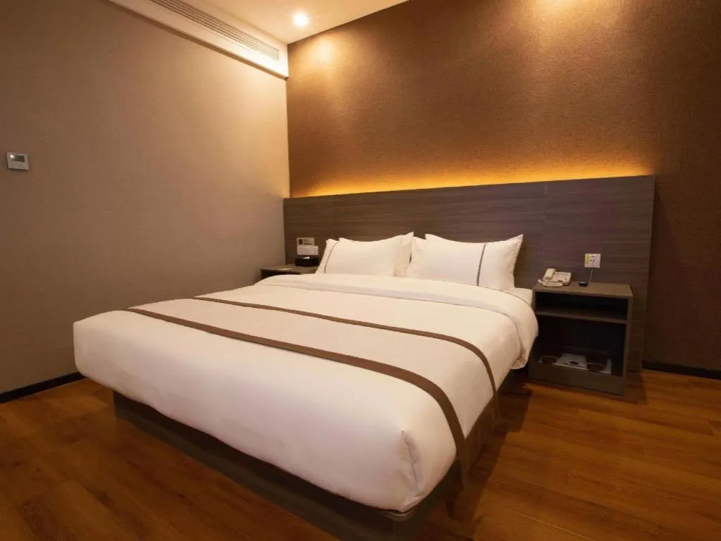 Bed in Jtour Inn Wuxi Meiyuan Kaiyuan Temple Metro