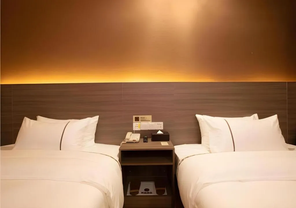 Bed in Jtour Inn Wuxi Meiyuan Kaiyuan Temple Metro