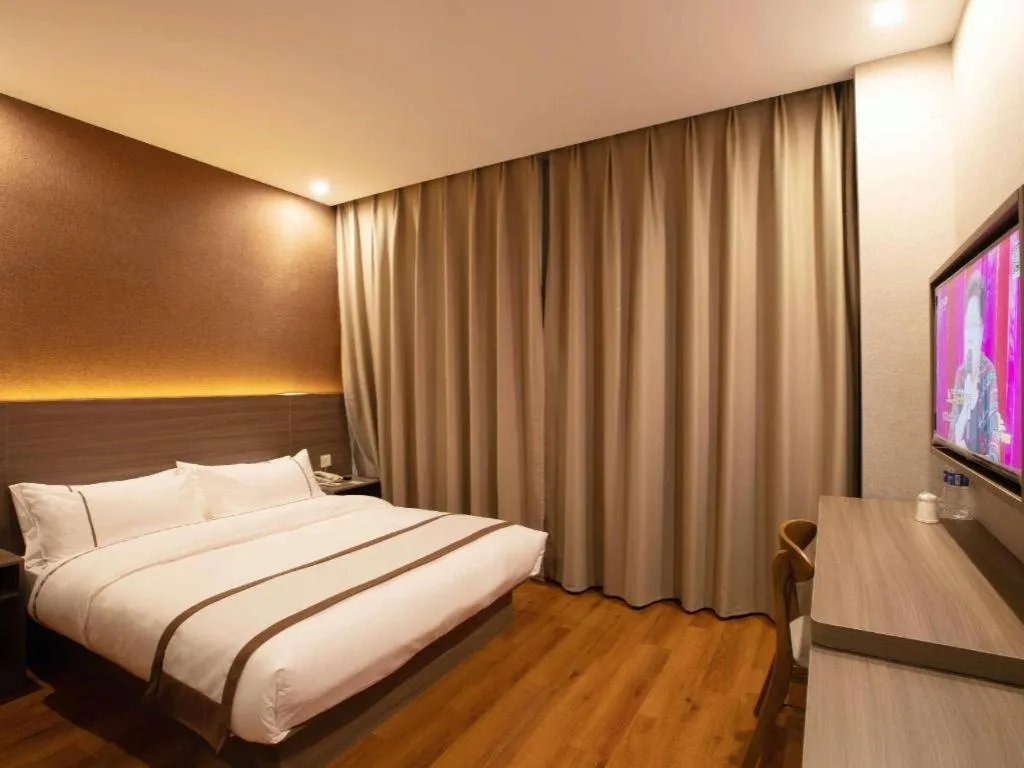 Bed in Jtour Inn Wuxi Meiyuan Kaiyuan Temple Metro