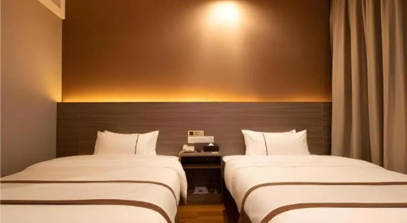 Bed in Jtour Inn Wuxi Meiyuan Kaiyuan Temple Metro