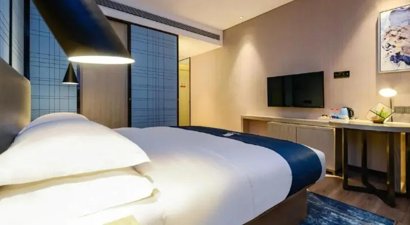 Bed in Echarm Hotel Guiyang Longdongbao International Airport Outlets