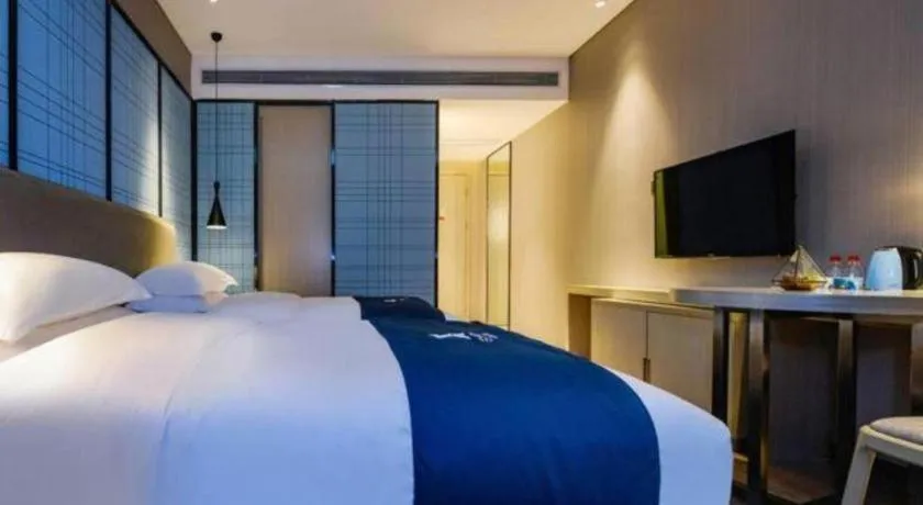 Bed in Echarm Hotel Guiyang Longdongbao International Airport Outlets