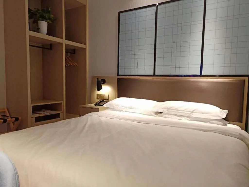 Bed in Borrman Hotel Hefei Guogou Plaza Sanli'an Metro Station