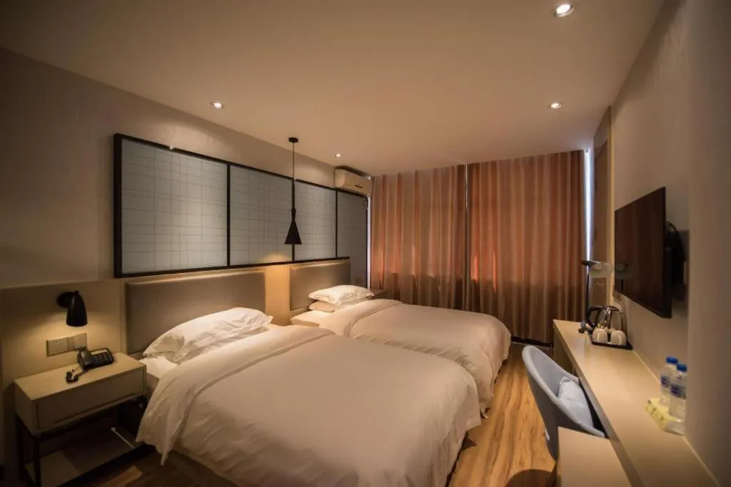 Bed in Borrman Hotel Hefei Guogou Plaza Sanli'an Metro Station