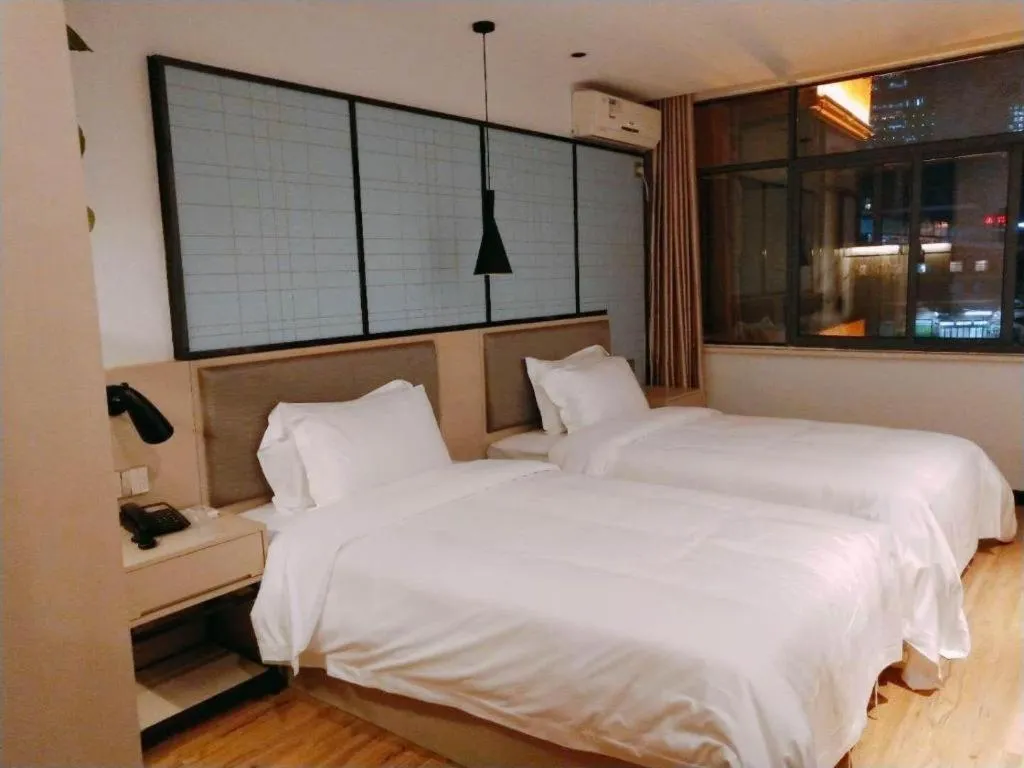 Bed in Borrman Hotel Hefei Guogou Plaza Sanli'an Metro Station