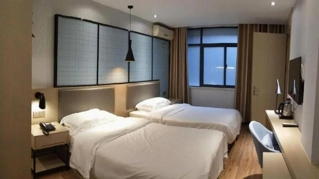 Bed in Borrman Hotel Hefei Guogou Plaza Sanli'an Metro Station