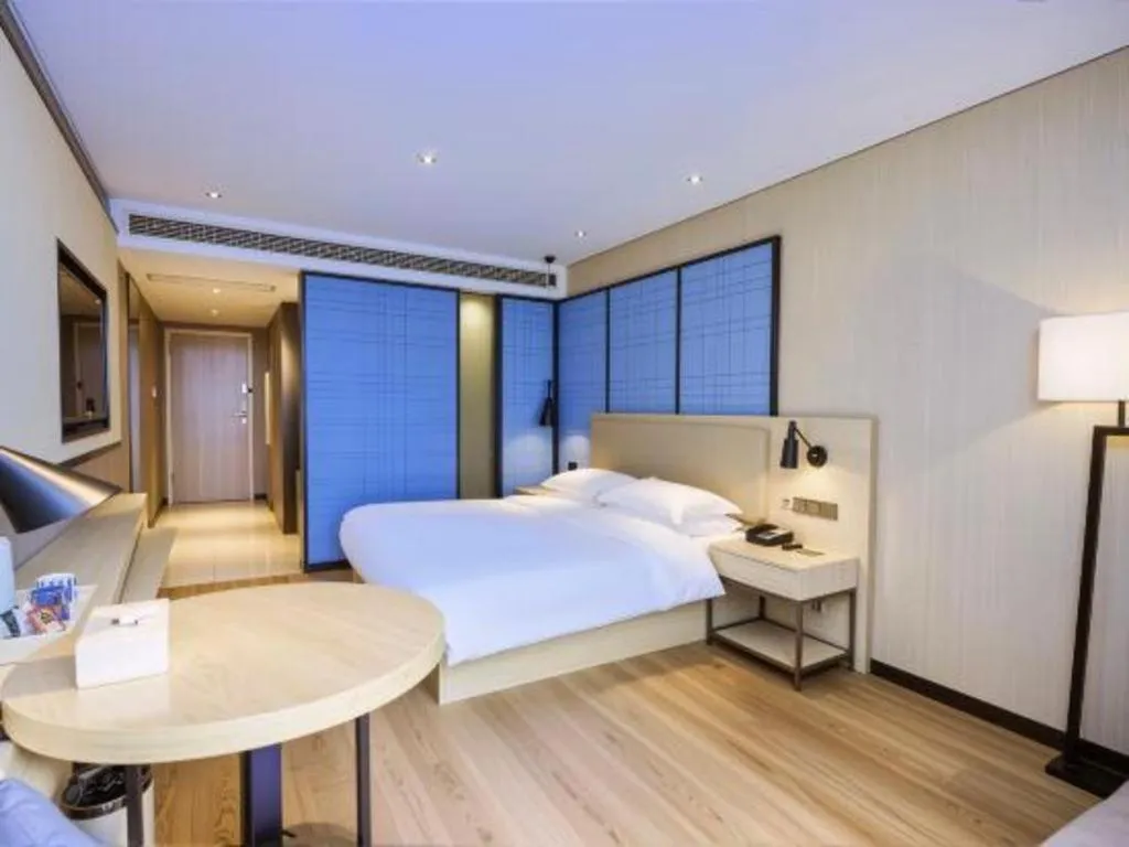 Bed in Echarm Hotel Aegean Shopping Park Zhonghuan Plaza