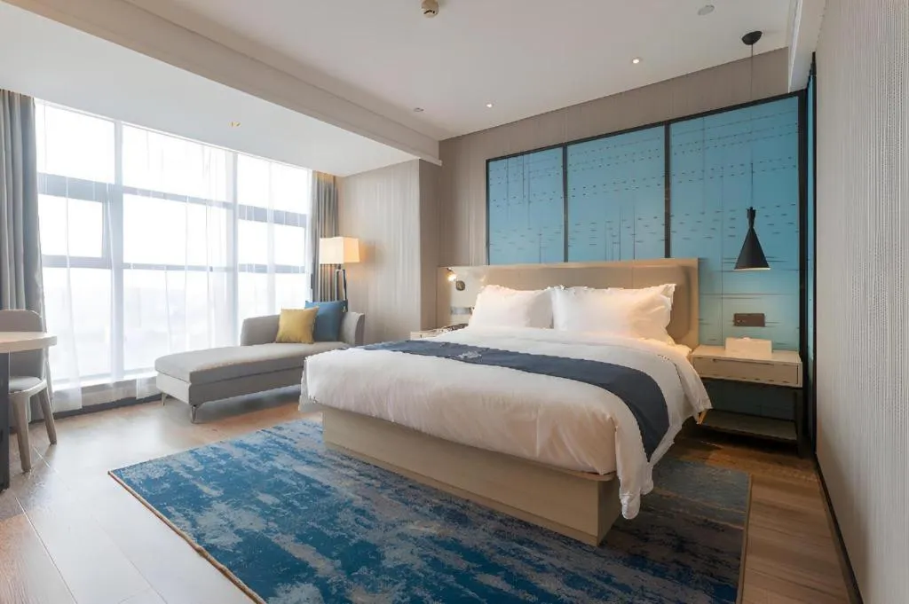 Bed in Echarm Hotel Aegean Shopping Park Zhonghuan Plaza