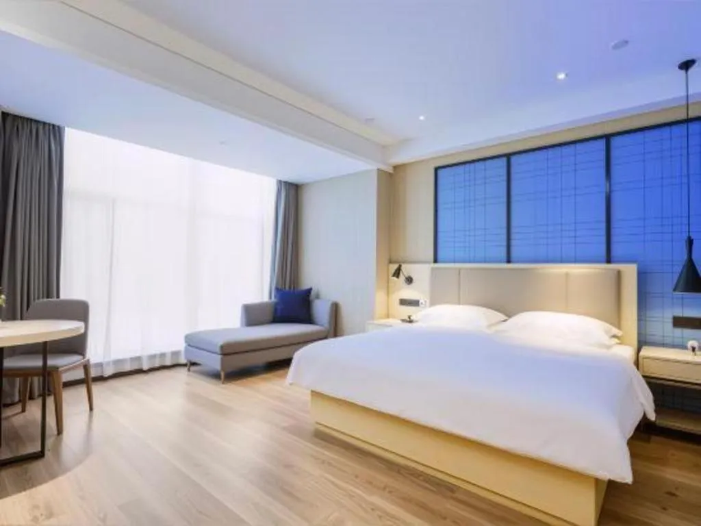Bed in Echarm Hotel Aegean Shopping Park Zhonghuan Plaza