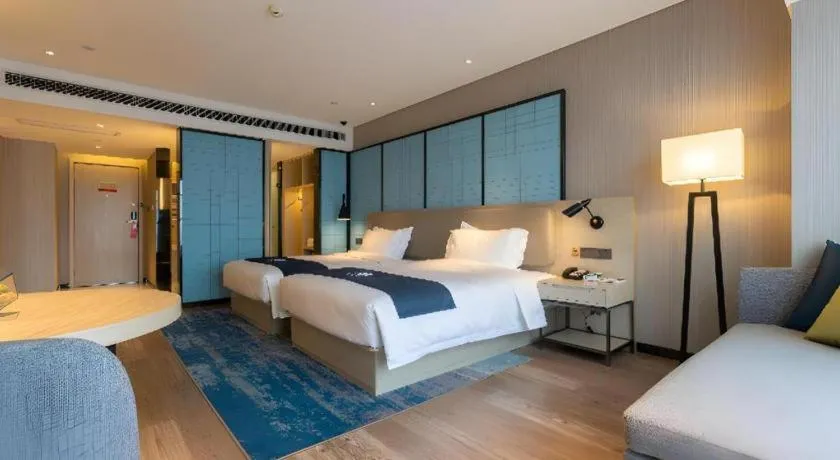 Bed in Echarm Hotel Aegean Shopping Park Zhonghuan Plaza