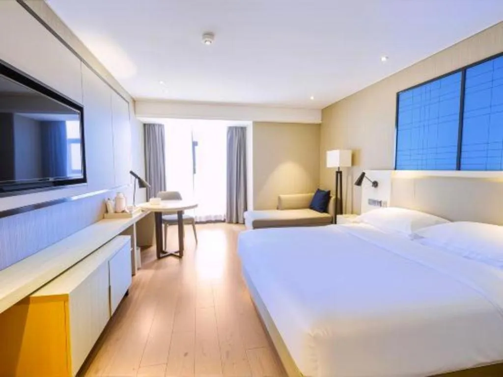 Bed in Echarm Hotel Aegean Shopping Park Zhonghuan Plaza