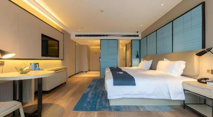 Bed in Echarm Hotel Aegean Shopping Park Zhonghuan Plaza