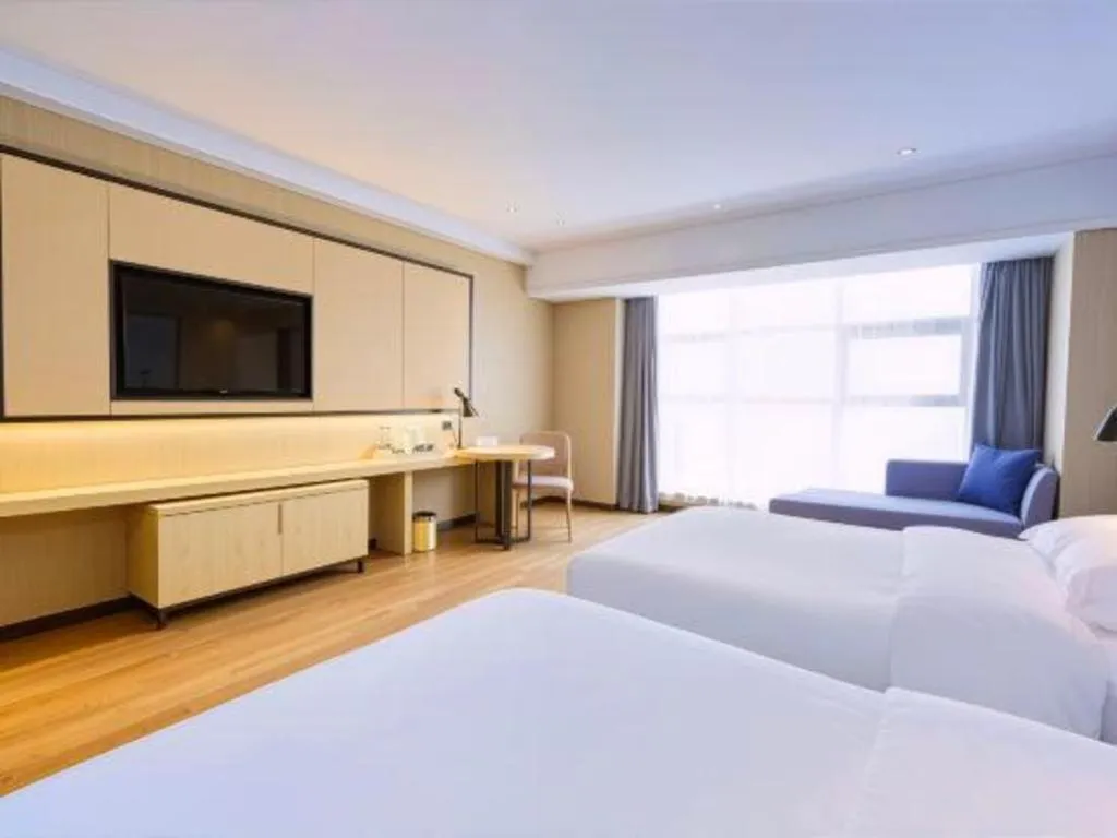 Bed in Echarm Hotel Aegean Shopping Park Zhonghuan Plaza