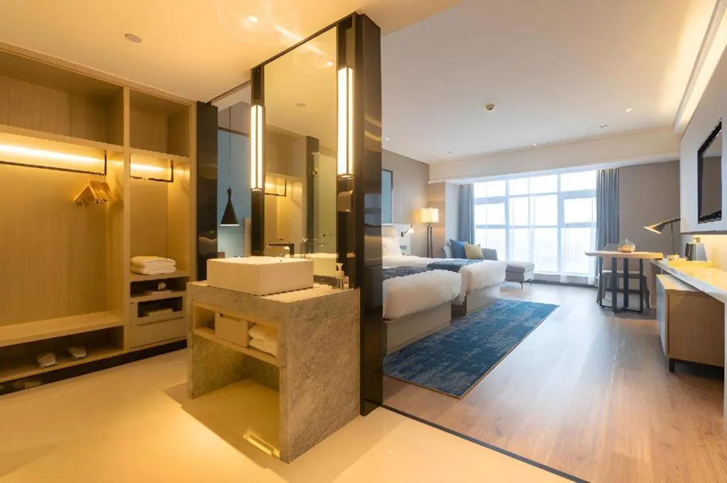 Bed in Echarm Hotel Aegean Shopping Park Zhonghuan Plaza