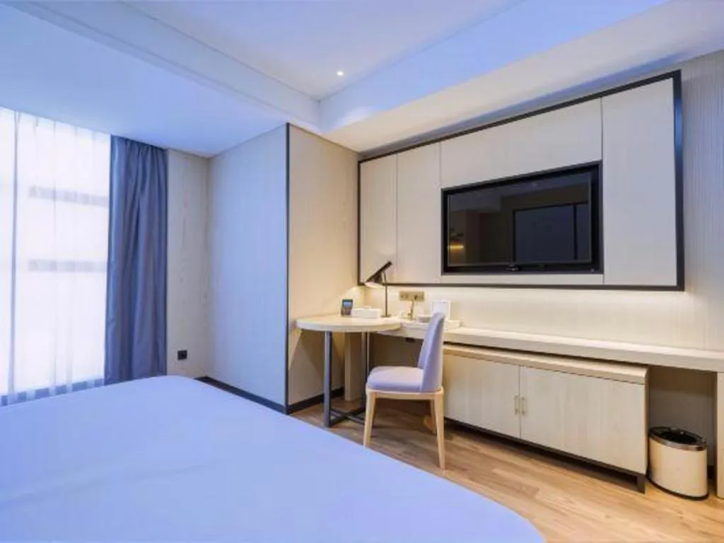 Bed in Echarm Hotel Aegean Shopping Park Zhonghuan Plaza