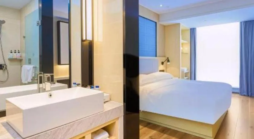 Bed in Echarm Hotel Aegean Shopping Park Zhonghuan Plaza