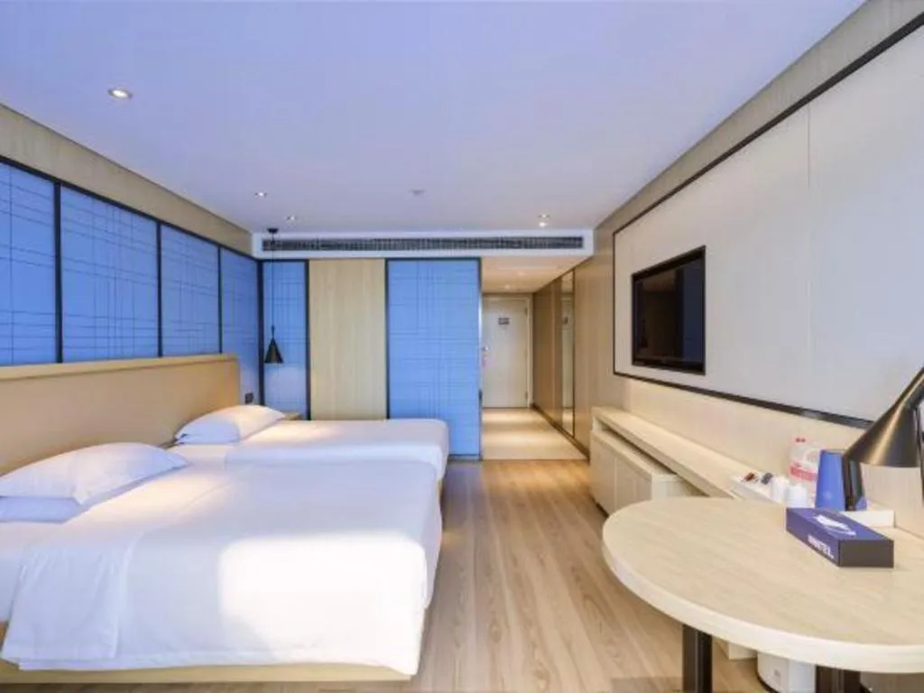 Bed in Echarm Hotel Aegean Shopping Park Zhonghuan Plaza