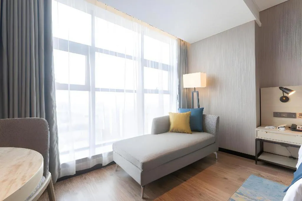 Bed in Echarm Hotel Aegean Shopping Park Zhonghuan Plaza