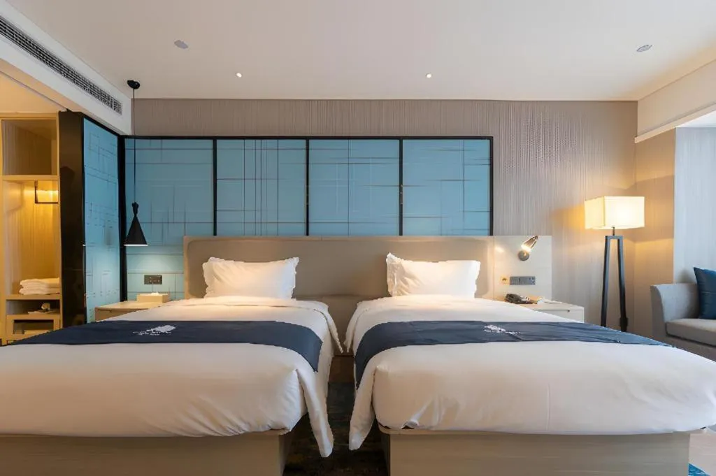 Bed in Echarm Hotel Aegean Shopping Park Zhonghuan Plaza