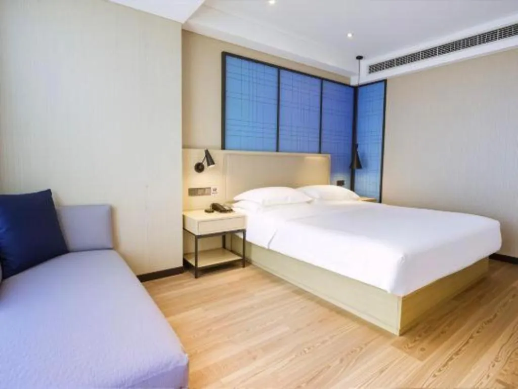 Bed in Echarm Hotel Aegean Shopping Park Zhonghuan Plaza