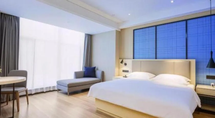 Bed in Echarm Hotel Aegean Shopping Park Zhonghuan Plaza