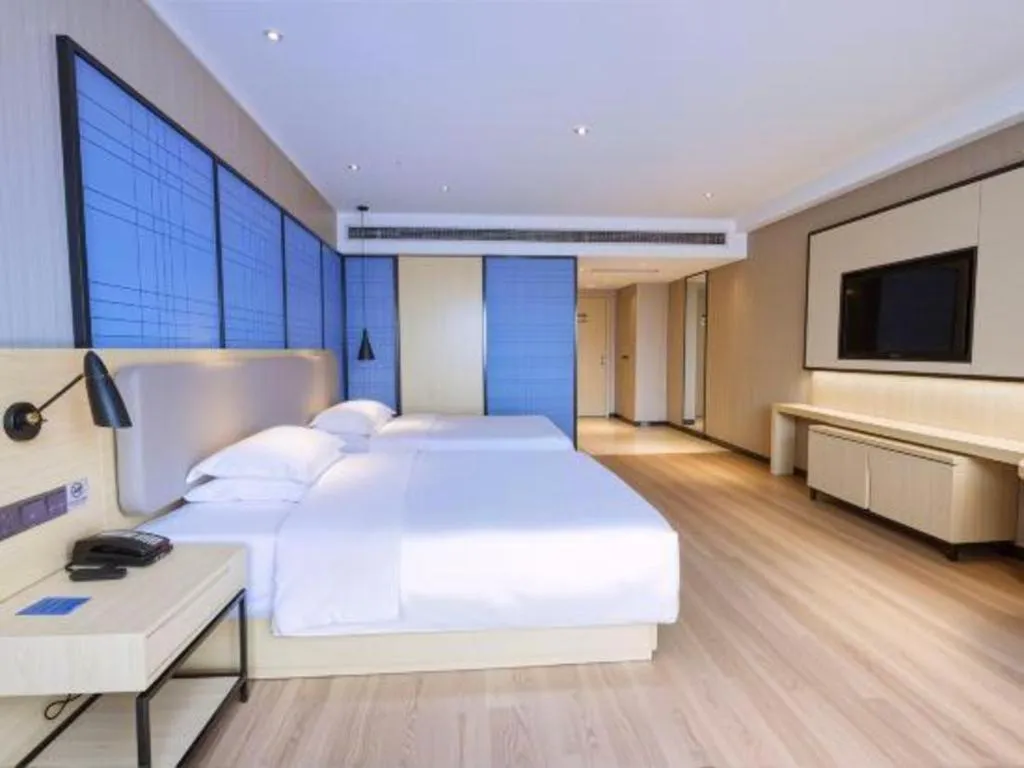 Bed in Echarm Hotel Aegean Shopping Park Zhonghuan Plaza