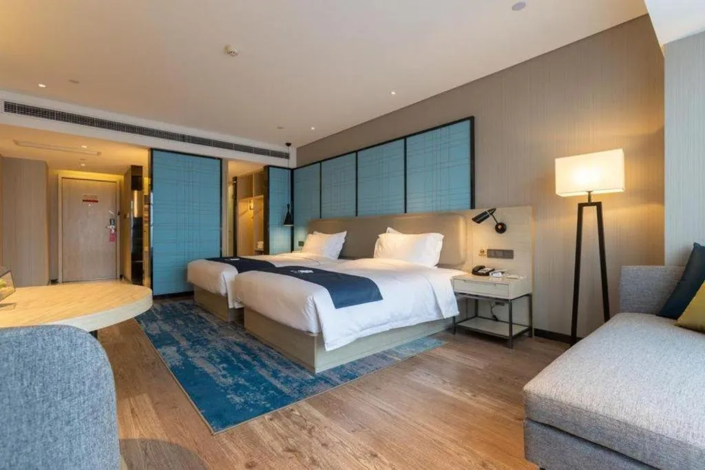 Bed in Echarm Hotel Aegean Shopping Park Zhonghuan Plaza