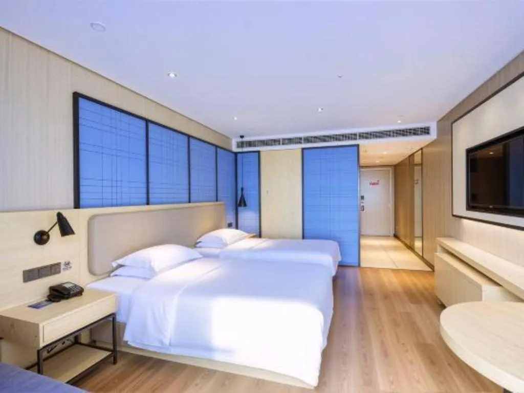 Bed in Echarm Hotel Aegean Shopping Park Zhonghuan Plaza
