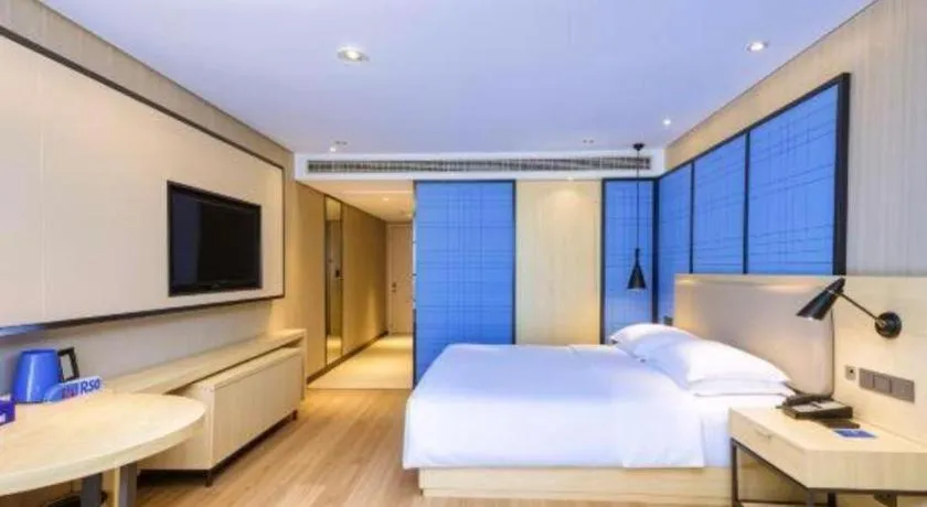 Bed in Echarm Hotel Aegean Shopping Park Zhonghuan Plaza