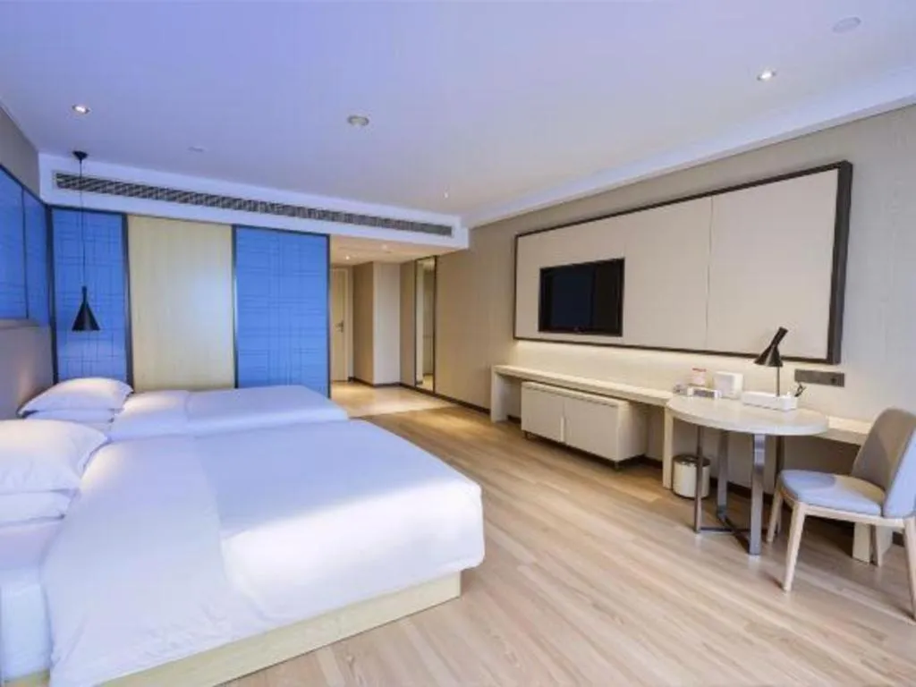 Bed in Echarm Hotel Aegean Shopping Park Zhonghuan Plaza