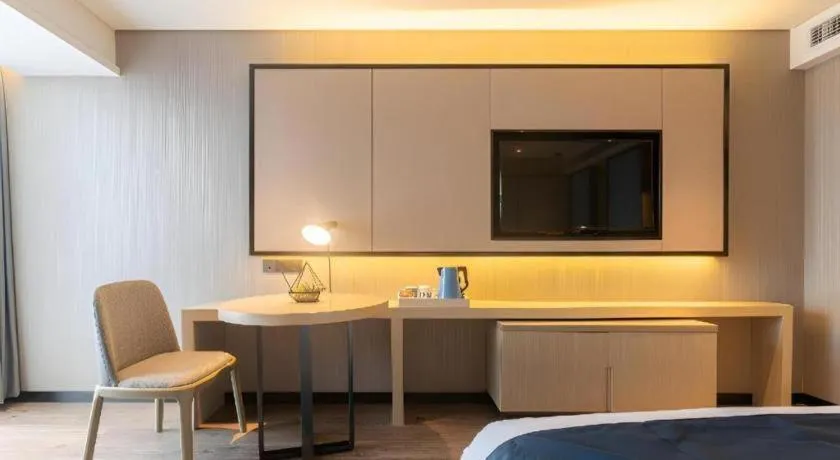 Bed in Echarm Hotel Aegean Shopping Park Zhonghuan Plaza