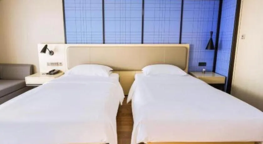 Bed in Echarm Hotel Aegean Shopping Park Zhonghuan Plaza